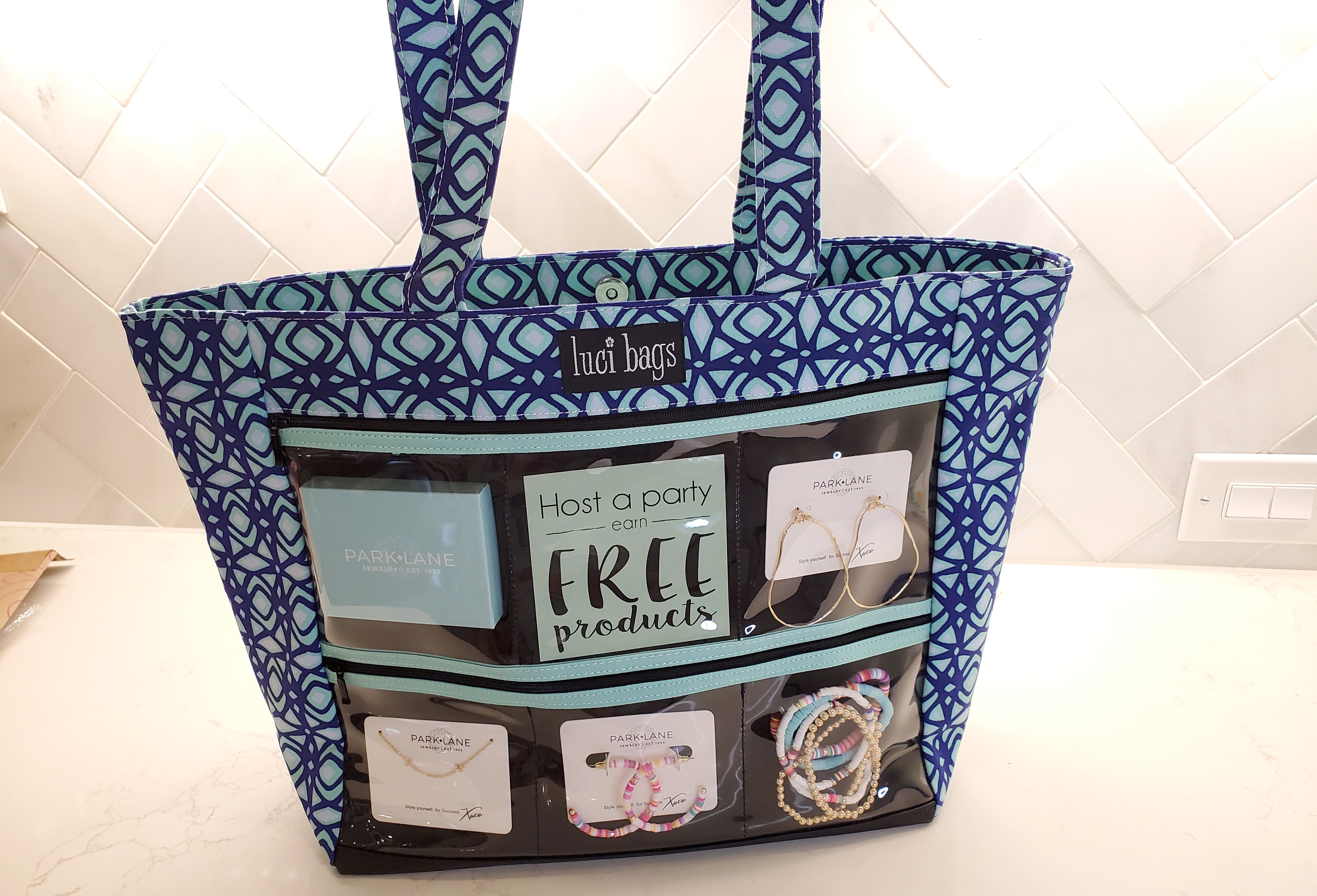 Load video: Video showing how to display jewelry in a Calypso Large Luci Bag Display Tote.